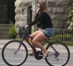 Cyclingwomanwearingminiskirt.jpg