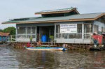 Buying-vegetables-at-the-Community-Drinking-Water-houseboat[...].jpg