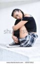 stock-photo-vertical-low-angle-portrait-of-a-girl-sitting-o[...].jpg