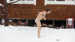 stock-footage-girl-in-a-swimsuit-washes-with-snow-in-winter[...].webm