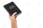 42516857-Hand-holding-bible-on-white-background-Stock-Photo