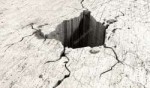 depositphotos12630207-stock-photo-hole-in-the-cracked-ground.jpg