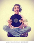 young-boy-listening-music-sitting-450w-218026228.jpg