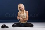 16493774-attractive-blond-woman-sitting-on-her-knees.jpg