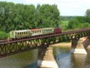 Trainnarrow-gaugerailwayonthebridgeovertheriverCheptsa.jpg